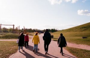 People walking in park on sunny day