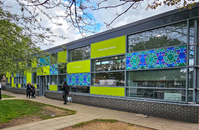 blue green mosaic art on some of the window panels at Northolt Library