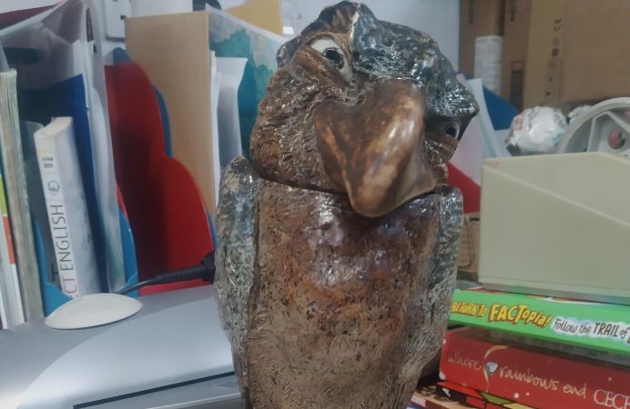 Close up of Wally Bird statue on desk