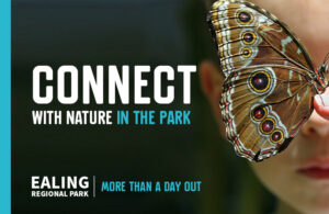 A butterfly flying in front of a girl's face. Banner says Connect with nature in the park.
