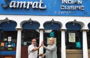 Cllr Brett congratulates the owner of Samrat Indian Cuisine