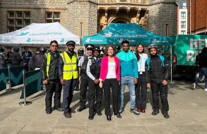 Cllr Costigan, police and food delivery drivers at road safety event