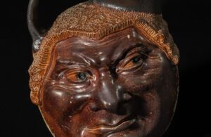 Close up of ceramic jug with man's face by the Martin brother
