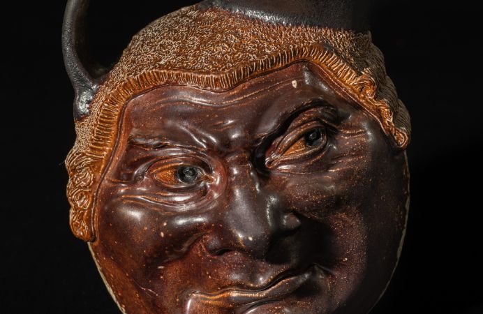 Close up of ceramic jug with man's face by the Martin brother