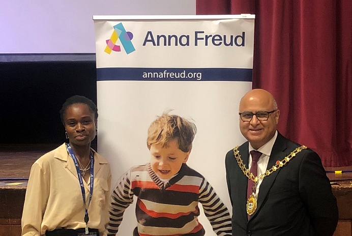 L-R Black woman, picture of boy in stripy top, Mayor of Ealing Councillor Hitesh Tailor