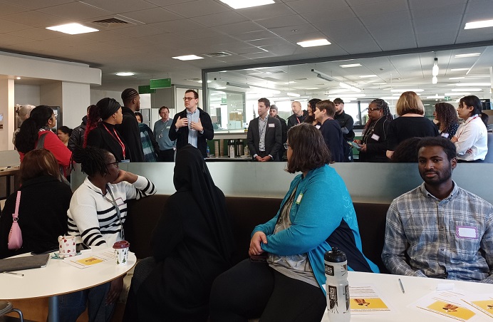 Office with large group of young people and council officers