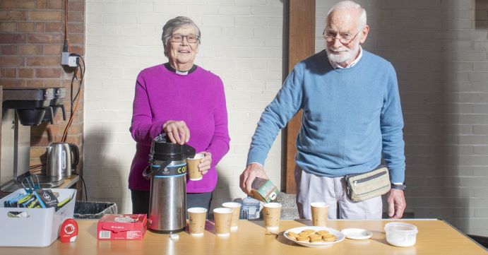 man and woman making hot drinks in St Barnabas Church