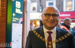 Ealing mayor Cllr Hitesh Tailor getting ready to meet the King during Charles III's visit to Ealing Broadway shopping centre, 7th December 2023