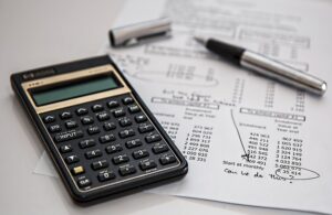 A calculator and budget sheet