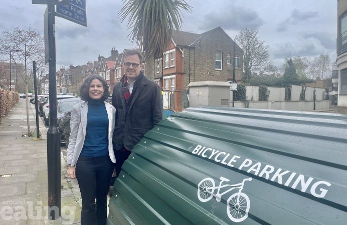 Cllr Mason and Cllr Costigan pose beside 100th bike hanger installed in borough