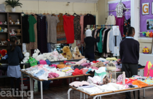 Room full of clothes which children have outgrown, toys, books