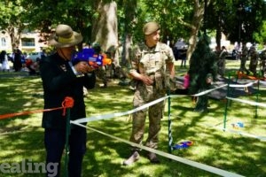 Gurkha trying out Nerf gun activities outdoors