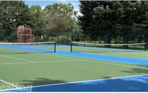 Tennis court with green and blue surfacing.