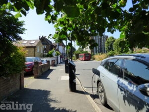 Aparked car connected to an electric vehicle charging station