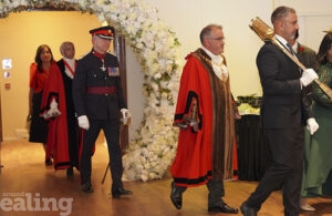 Walling under a flower garland: mayor's consort bearing the mace, followed by the mayor in his robes, and the King's representative Richard Kornicki