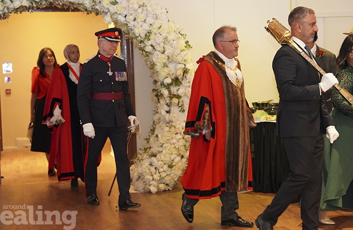 Walling under a flower garland: mayor's consort bearing the mace, followed by the mayor in his robes, and the King's representative Richard Kornicki