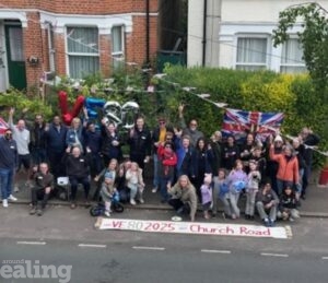Residents of Church Rd gather for 80th anniversary of VE day street party with VE balloon and UK flag