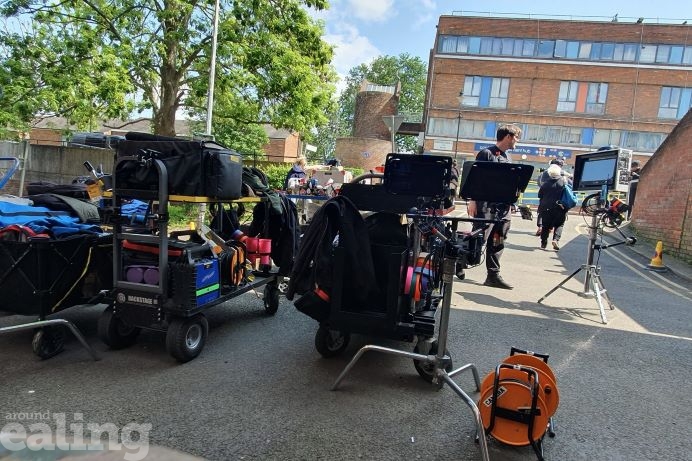 Camera crew and equipment at an outdoor location