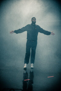 Samuel Durrant, Respect the Studio's director, walking on what it looks like a stage