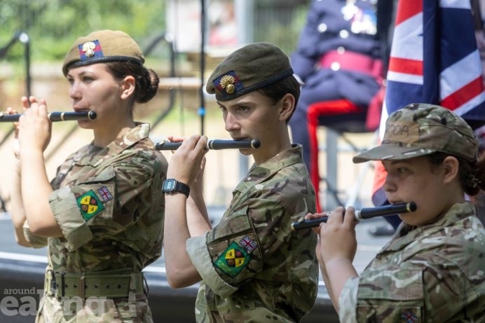 Three cadets playing the flute