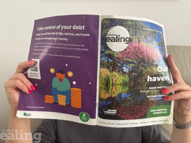 Person holding up a copy of Around Ealing magazine