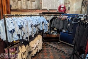 School uniform hung on rails