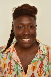 black woman smiling (head and shoulders)