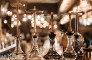 Shisha bottles sitting on a bar