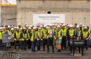 group of people standing together wearing high visibility vests and hard hats