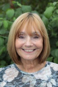 head and shoulders of woman smiling