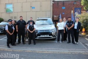 Police officers and council staff outside Acton Police Station during Anti-Social Behaviour Week 2025