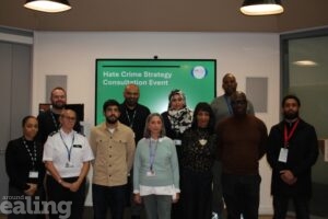 Two rows of staff posing for a photograph at the Hate Crime Strategy Consultation Event