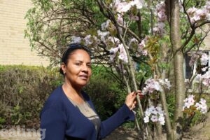 Josephine standing by a tree at Sycamore Lodge