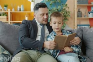 A father reading to his son