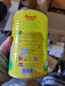 Yellow packet of ghee, a type of butter. Packet says for sale in India only