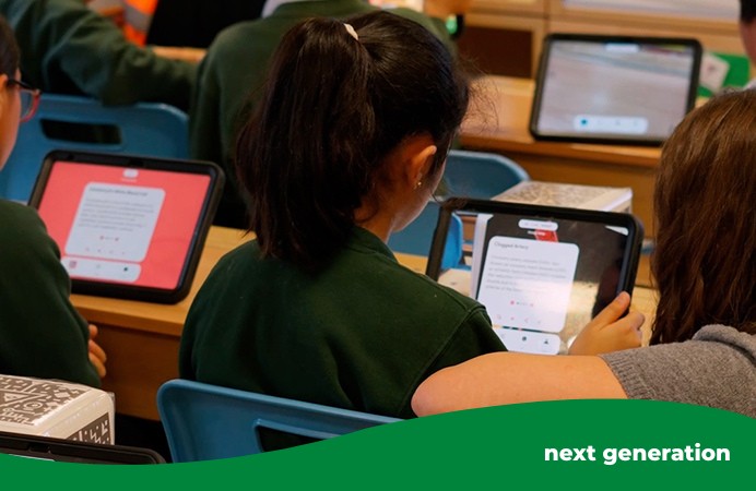 School pupils using tablet devices in a classroom