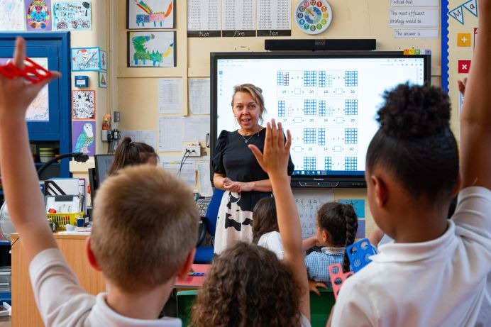 A teacher and pupils at Stanhope Primary School