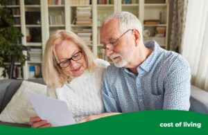 An elderly couple looking at a bill