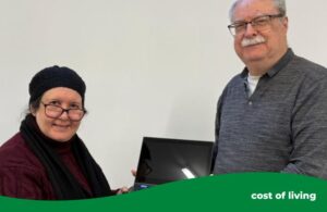 man and woman holding a laptop