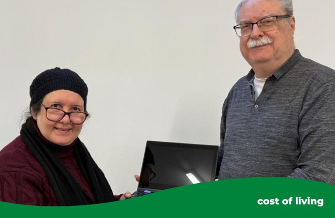 man and woman holding a laptop