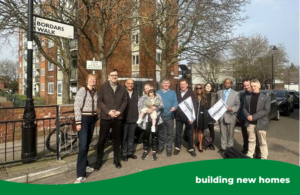 A group of people standing on a road