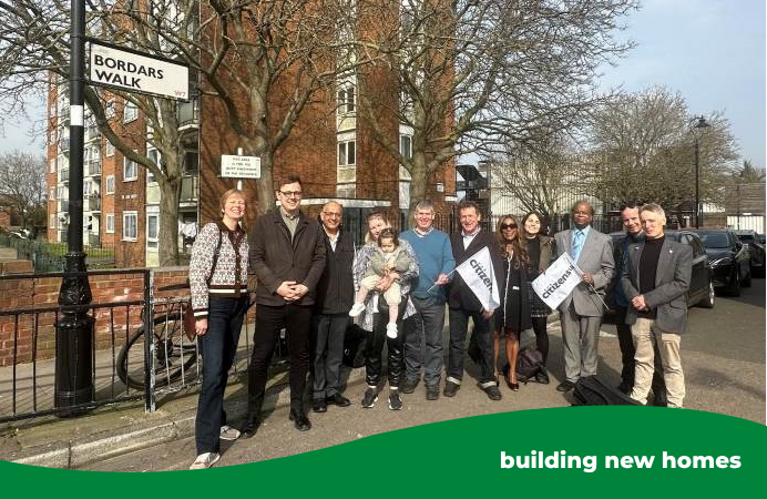 A group of people standing on a road