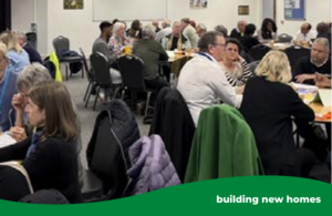 People sitting around tables talking