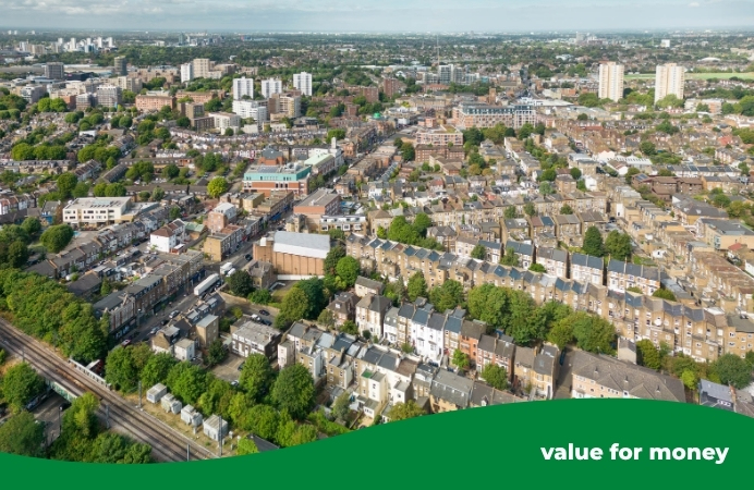 Aerial view of Acton, showing rows of houses, roads and trees