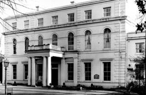 A grand, white, building with a columned entrance