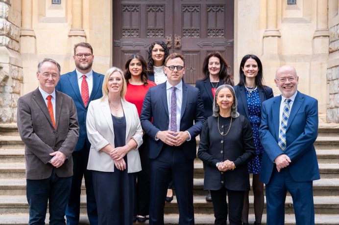 10 men and women that make up Ealing's cabinet members standing on the Town Hall steps