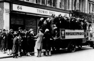 People packed on to an open top van