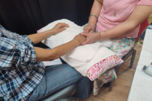 Carer holding someone's hand