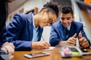 Students writing on some paper