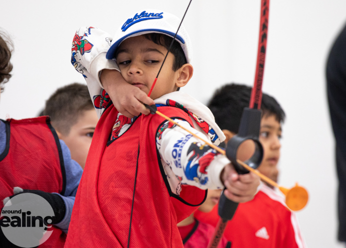 Child enjoys archery as part of HAF activities